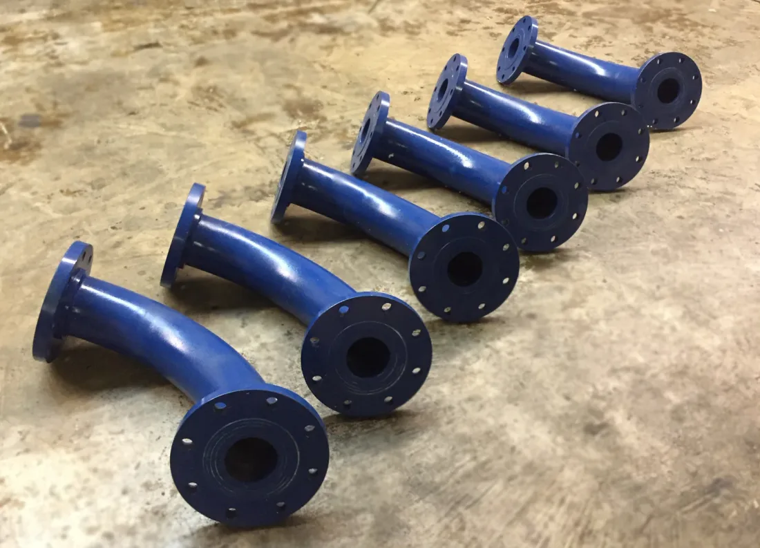 A row of blue ceramic lined elbows