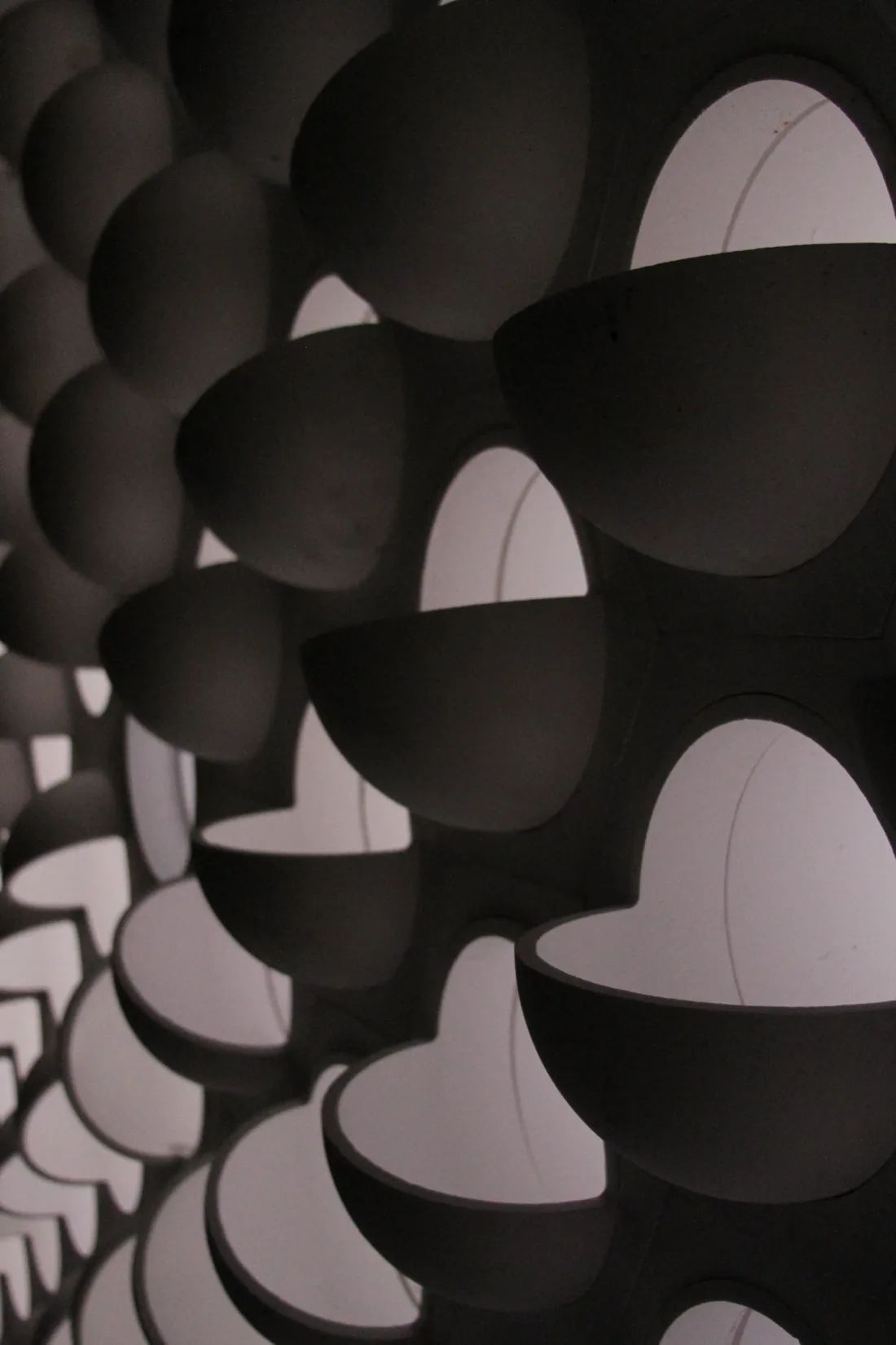 Close view of angled tiles set into a ceramic checkerwall
