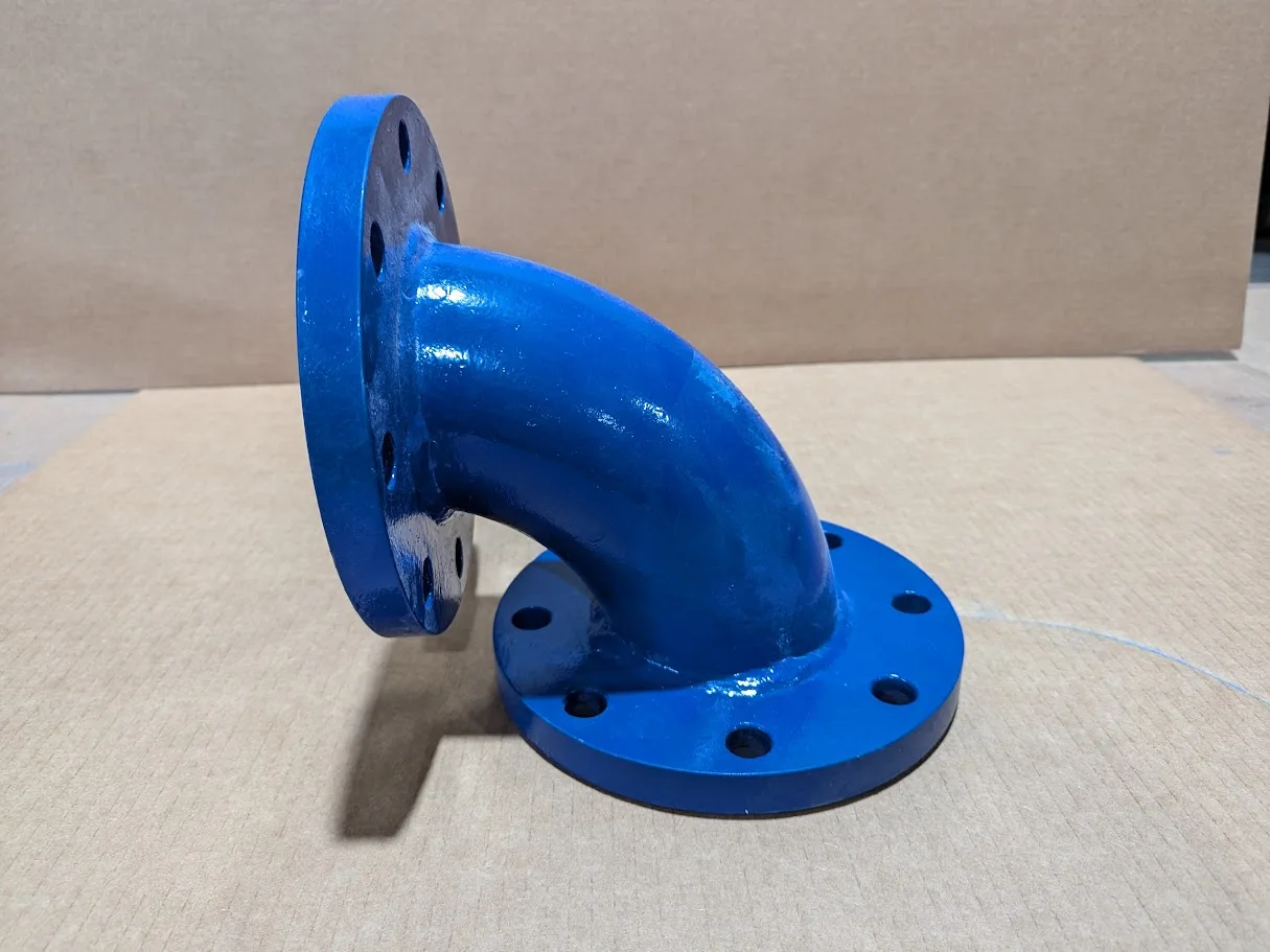 Blue flanged ceramic lined elbow on cardboard