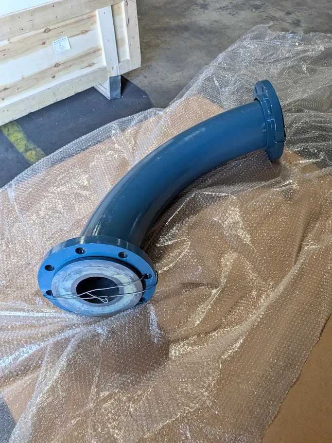 Long radius ceramic lined bend with flange