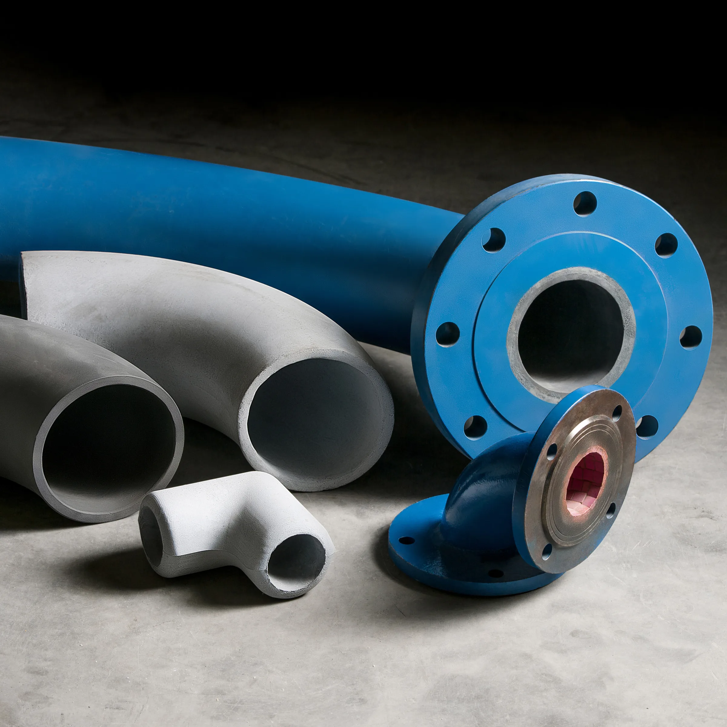 Lined elbows and tees with blue and gray steel shells