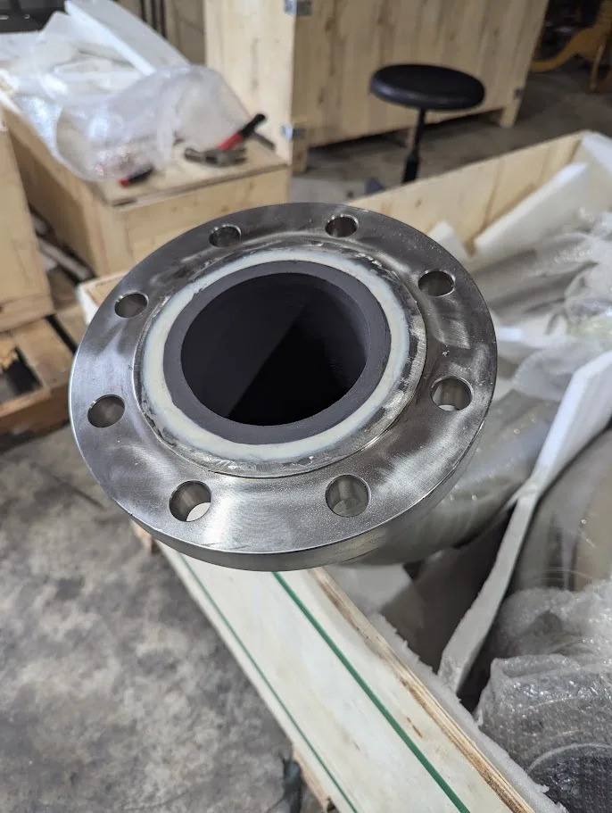 Ceramic lined spool packed in a crate, liner visible at the flange