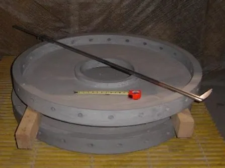 Large ceramic micronizer ring with bolt holes on a pallet