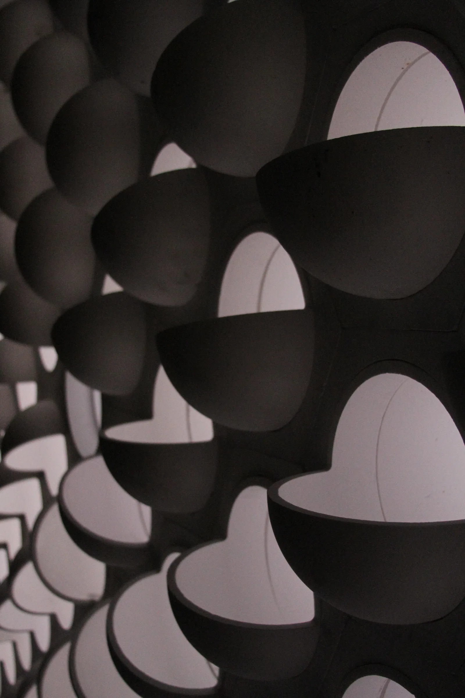 Close view of angled tiles set into a ceramic checkerwall