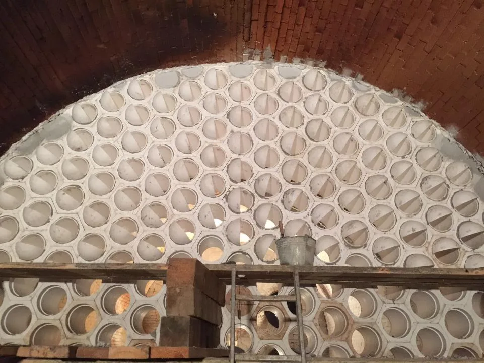 Checkerwall with angled openings installed in a furnace